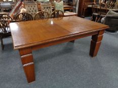 A 19th century mahogany windout dining table with two leaves