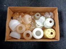 A box of assorted glass light shades