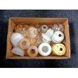 A box of assorted glass light shades