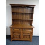 A good quality oak double door Welsh dresser, fitted two drawers.