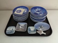 A tray of sixteen Royal Copenhagen Christmas plates, shallow dishes,