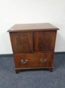 A Victorian inlaid mahogany commode chest