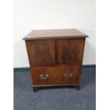 A Victorian inlaid mahogany commode chest