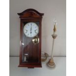 Comitti of London eight day wall clock and a contemporary table lamp