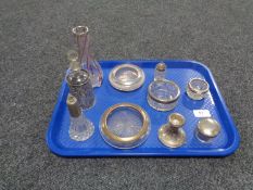 A box of various silver topped items