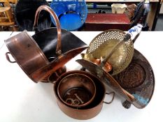 A box containing antique copper ware to include a copper log basket on paw feet,