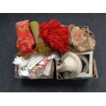 Two boxes containing woolen rugs, table linens, curtains, fur hat etc.