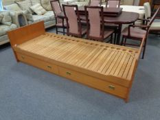 A pine 3 ft pull out bed frame, fitted two drawers beneath.