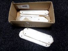 A box containing early 20th century ceramic finger plates.