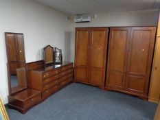 A late 20th century Olympus five piece bedroom suite comprising of pair of double door wardrobes,