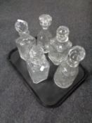 A tray containing five cut glass lead crystal decanters.