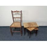 An Edwardian bergere seated bedroom chair together with a nest of three mid century tables