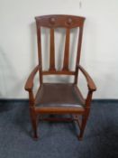 An Edwardian Arts and Crafts armchair.
