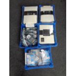 Five plastic crates containing triple blade razors and nose clips (new),