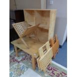 A square pine coffee table together with a set of pine cube shelves,