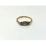 A three stone diamond ring, size M. CONDITION REPORT: 1.2g. Marks rubbed.