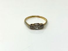 A three stone diamond ring, size M. CONDITION REPORT: 1.2g. Marks rubbed.