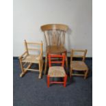 A pine kitchen chair together with two rush seated child's chairs and a further pine rush seated