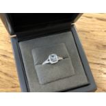 An 18ct white gold diamond and aquamarine ring, total diamond weight 0.