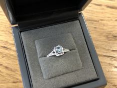 An 18ct white gold diamond and aquamarine ring, total diamond weight 0.