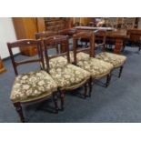 A set of six late 19th century mahogany dining chairs upholstered in a green brocade fabric