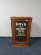 A wall mounted display cabinet bearing later Fry's Chocolate advertisement