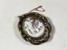 A Victorian mourning cameo brooch.