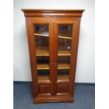 An Ernest Menard double door vitrine cabinet