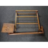 A 20th century towel rail together with a fire curb and an oak foot stool.