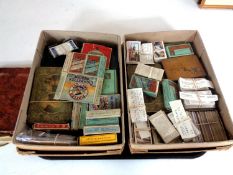 A tray containing two boxes containing a large quantity of assorted cigarette cards,