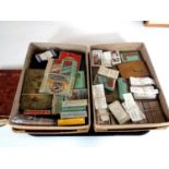 A tray containing two boxes containing a large quantity of assorted cigarette cards,