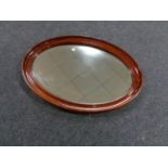 Two antique oval mirrors