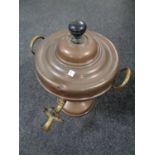 An antique brass and copper Samovar.