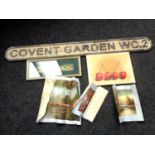 A wooden Covent Garden street sign together with a box containing unframed oil on canvas of