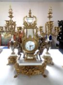 An impressive brass and white marble French three piece Imperial clock garniture
