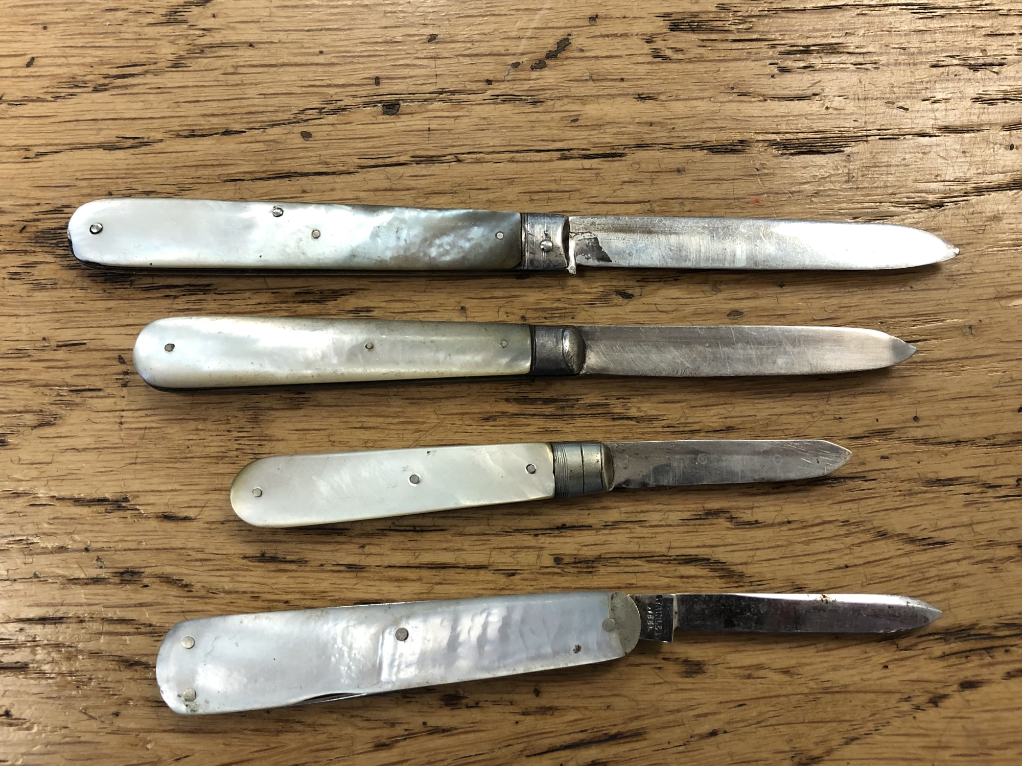Three antique silver and mother of pearl handled fruit knives, plus one with stainless steel blade. - Image 2 of 2