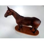 A Royal Doulton figure of a horse - Arkle Champion Steeplechaser on wooden plinth