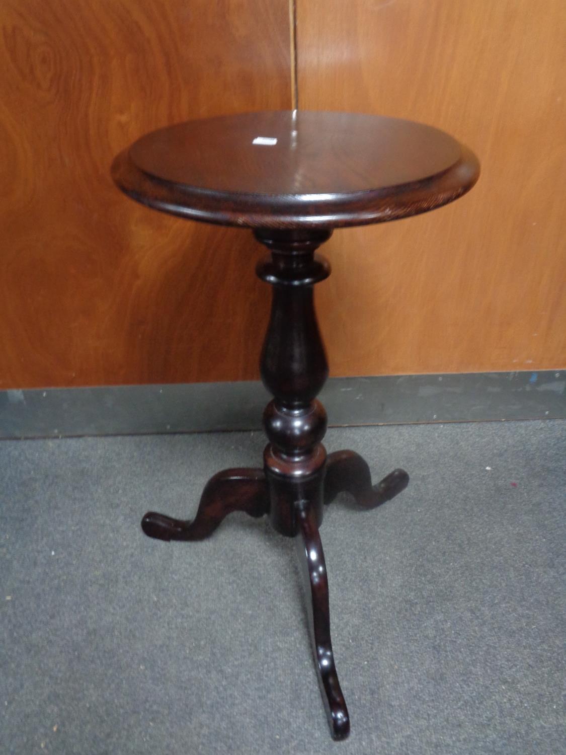 A wine table on three way pedestal