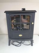 A Dimplex electric heater in the form of a stove.