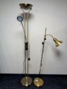 Two contemporary brass floor lamps