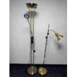 Two contemporary brass floor lamps