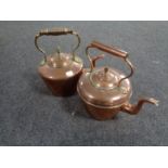 Two antique copper kettles, one with brass handle.