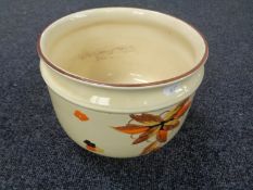 A 20th century hand painted pottery jardiniere.