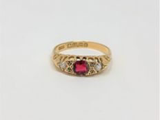 An 18ct gold diamond and garnet ring, size O CONDITION REPORT: 2.