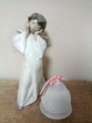 A Lladro figure of a cherub and a Lladro 1987 Christmas bell