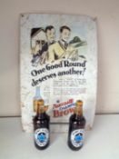 A tin Newcastle Brown Ale advertisement sign together with two bottles of Newcastle Brown Ale Alan