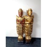 A pair of giltwood floor standing figures of Temple Guardians, 114cm high.