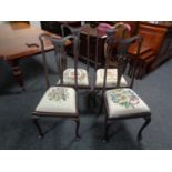 A set of four Edwardian mahogany Queen Anne style dining chairs with tapestry upholstered seats