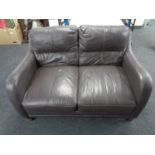A brown leather two seater settee