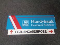 A German metal enamelled sign Frauengarderobe (Women's Wardrobe) and a perspex Co-operative Bank